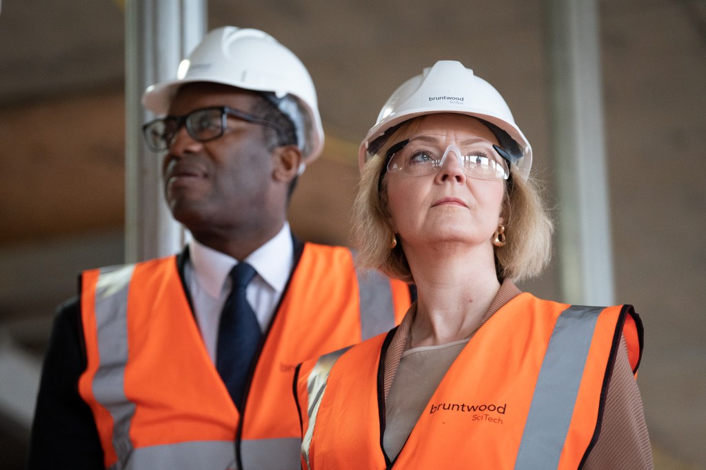 Kwasi Kwarteng and Liz Truss in hard hats