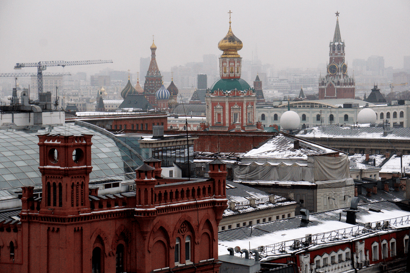 An aerial view of the city center as the Spassky Tower of Moscow's Kremlin seen at background in Moscow, Russia