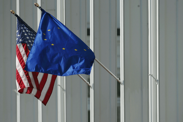The US and European Union flags on a wall
