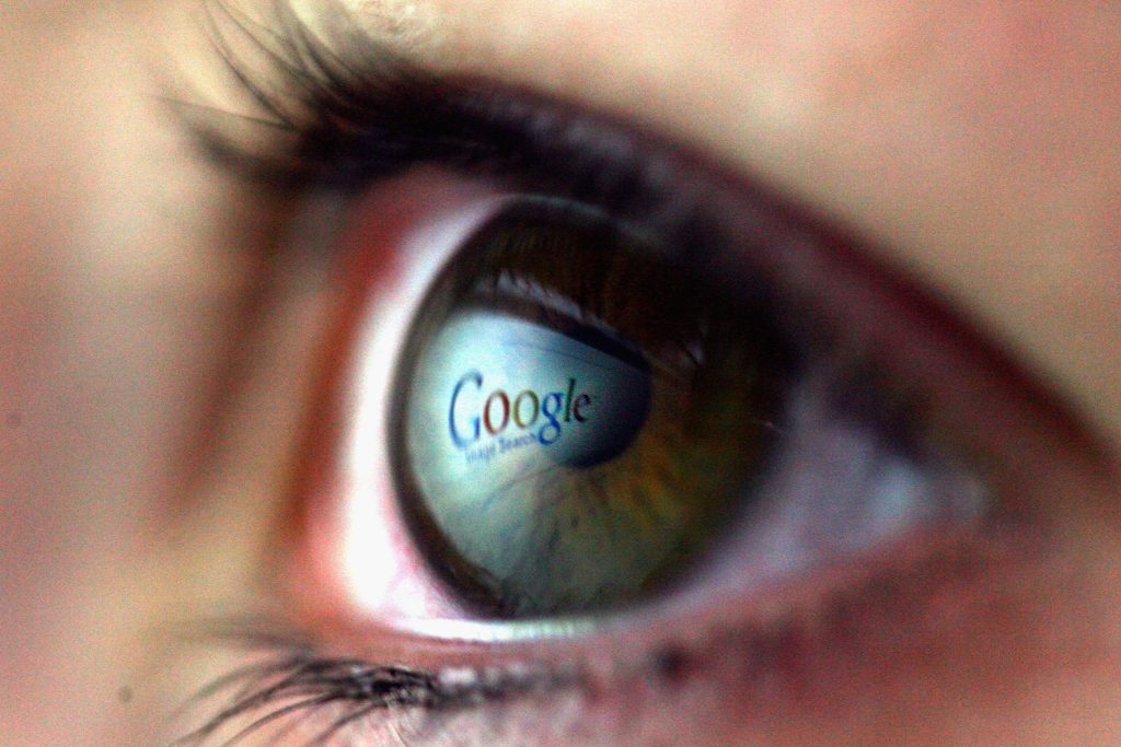 Image of an eye with the word "Google" reflected in it.