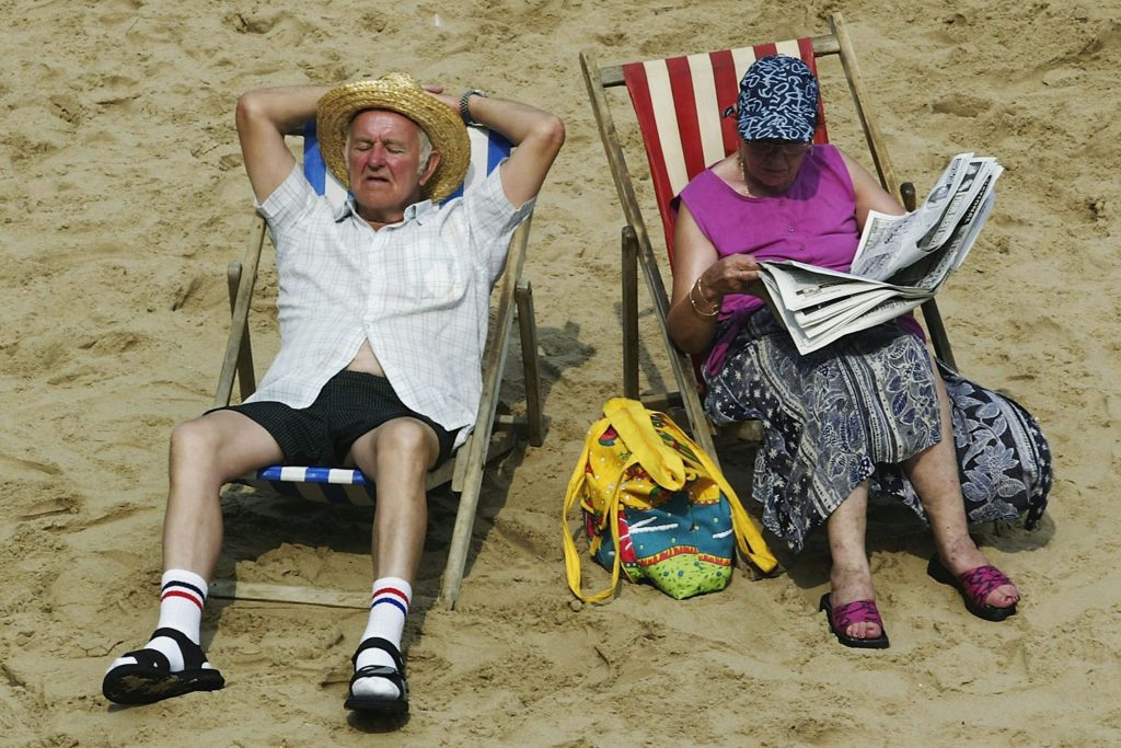 Image of an elderly couple on the beach.