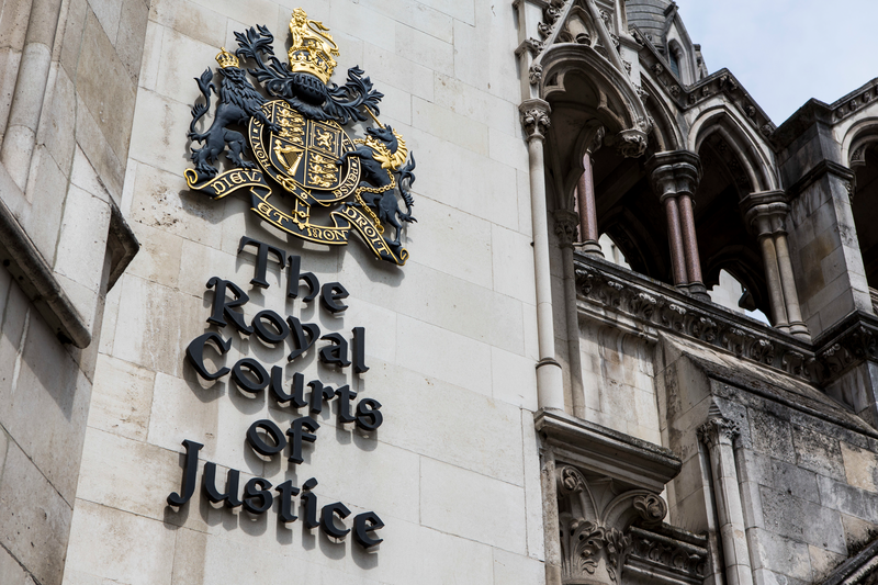 The sign outside The Royal Courts of Justice, commonly called the Law Courts, is a court building in London which houses both the High Court and Court of Appeal of England and Wales