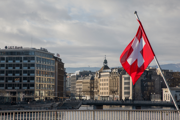 View of Geneva and Swiss flag