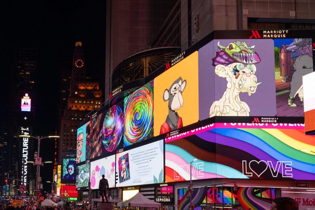 Image of NFT images on a screen in New York's Times Square.