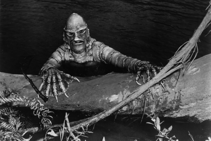 An amphibian-like monster coming out of the lagoon in a scene from the film 'Creature From The Black Lagoon', 1954.