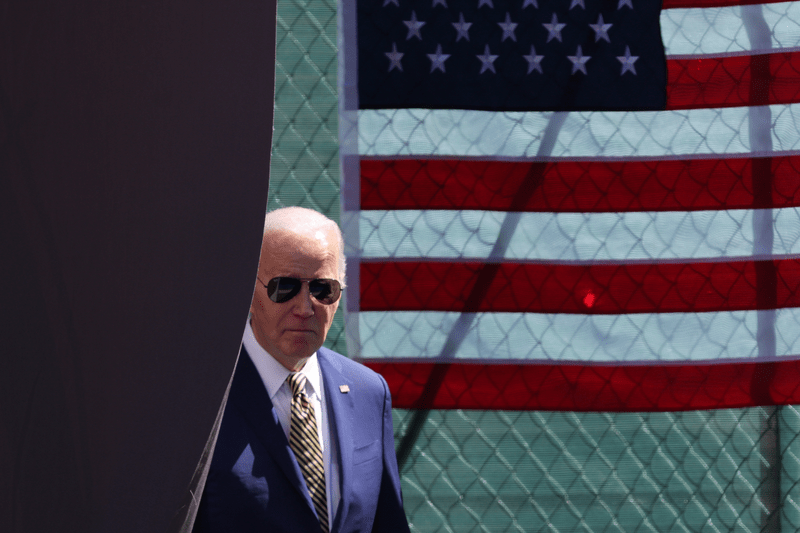 President Joe Biden with the US flag behind him.