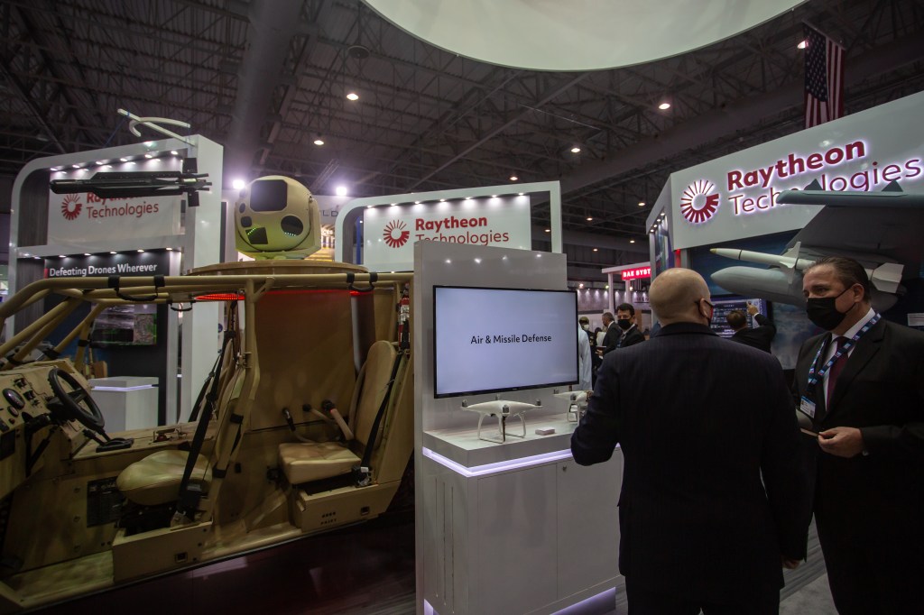 Image of Raytheon signage at a trade show.