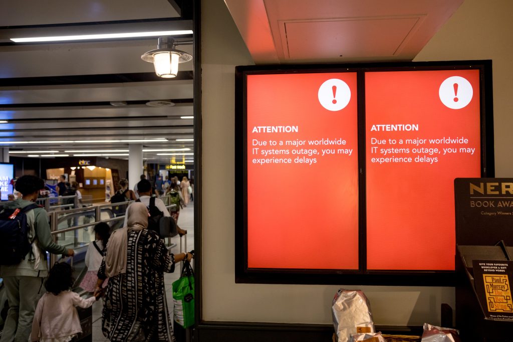 Image of service disruptions being announced on billboards due to the CrowdStrike systems failure.