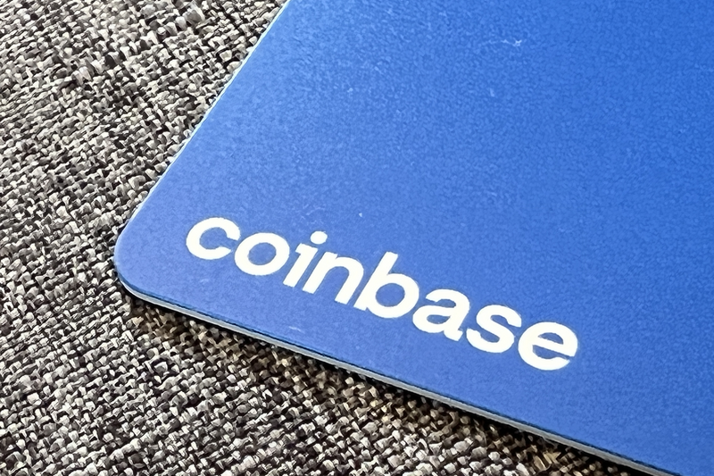 Logo for cryptocurrency exchange Coinbase on debit card edge.