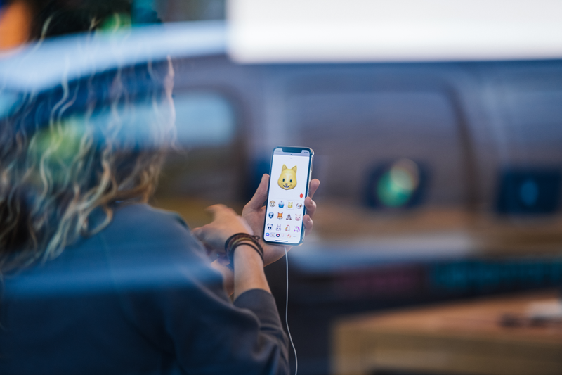 A woman is holding a phone.