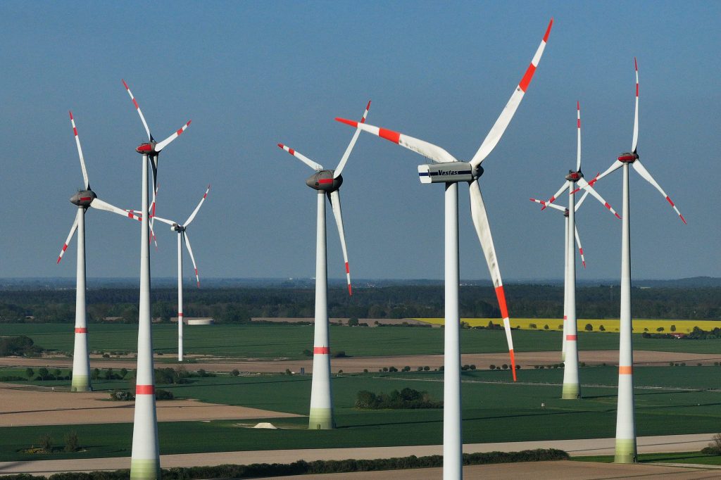 In this aerial view, wind turbines spin at a wind farm on May 02, 2024 near Altentreptow, Germany.