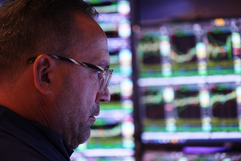 Traders work on the floor of the New York Stock Exchange.