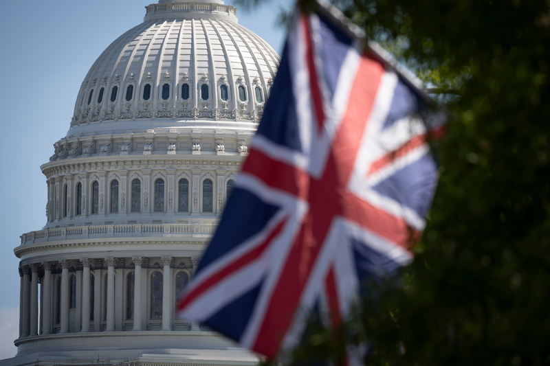 The national flag of the United Kingdom, fly along Pennsylvania Avenue near the US Capitol Building.