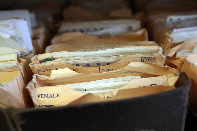 Folders containing patient records in the UK.