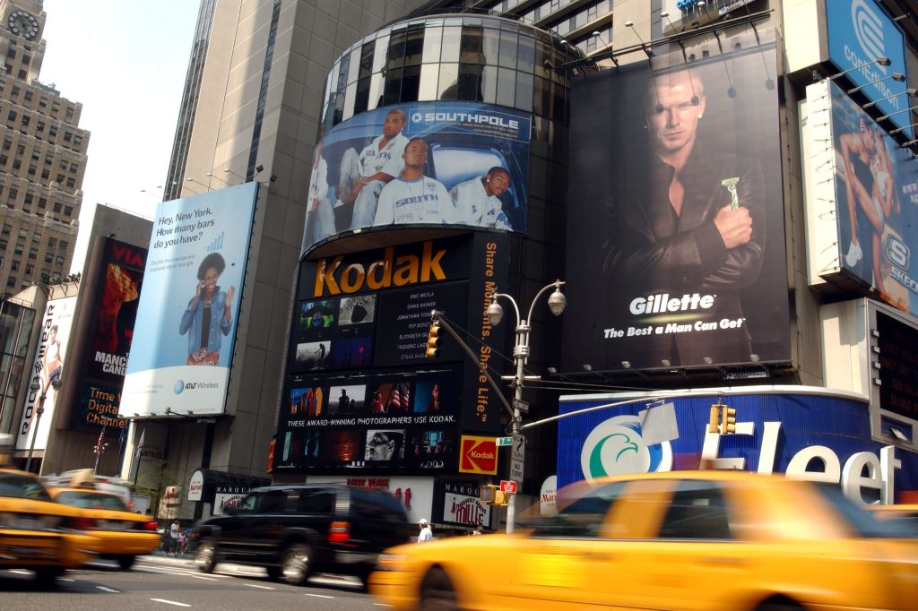 A Gillette advertisement featuring English soccer star David Beckham on a billboard in Times Square, NYC.