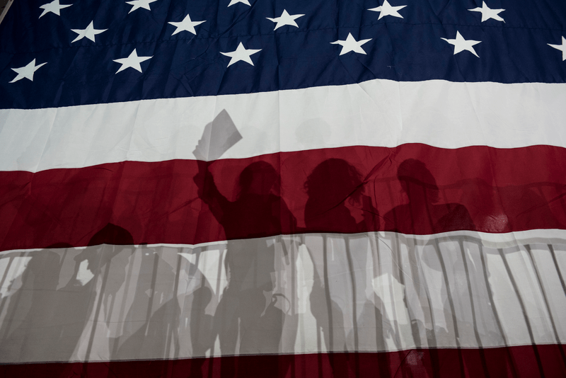 Silhouettes on a US flag.