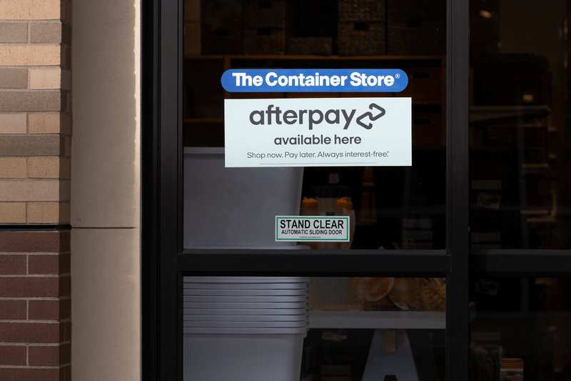 Door sticker advertising the availability of Afterpay is seen at the entrance to the Container Store in Tigard, Oregon. Afterpay is an Australian fintech company.