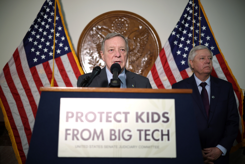 U.S. Sen. Richard Durbin (D-IL) (L) and Sen. Lindsey Graham (R-SC) speak to members of the press during a news briefing after a hearing before the Senate Judiciary Committee at the Dirksen Senate Office Building on January 31, 2024 in Washington, DC. The committee heard testimony from the heads of the largest tech firms on the dangers of child sexual exploitation on social media.