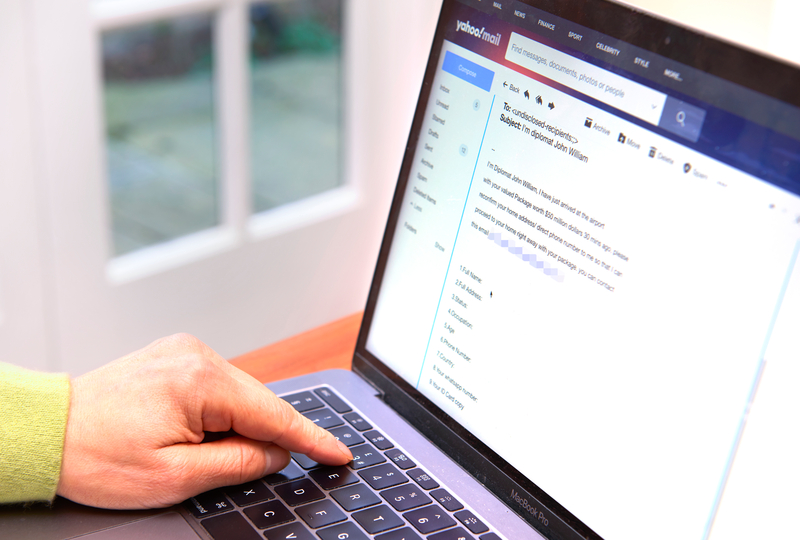 A person typing an email